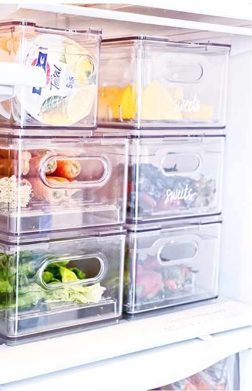 Healthy Fruit goes in the middle bin Home Kitchen Refrigerator organizing 101 with A Beautiful Mess 101 and The Container Store